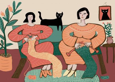 Women knitting on couch with black cat