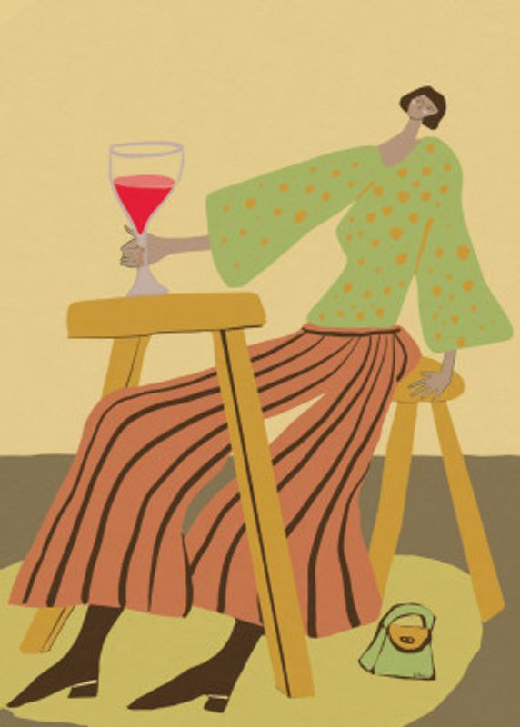 Just one glass.  Lady drinking wine