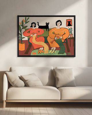 Women knitting on couch with black cat