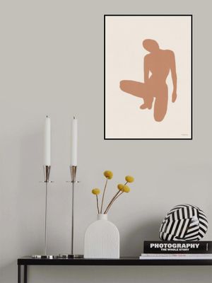 Brown Silhouette OfA Kneeling Figure
