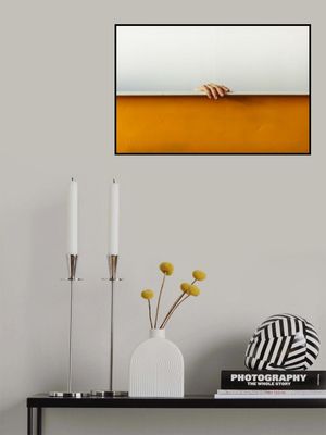 Human Hand Gripping The Top Edge