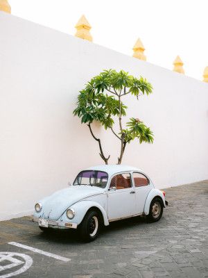 Pastel Volskwagen Beetle in the streets of Oaxaca Mexico
