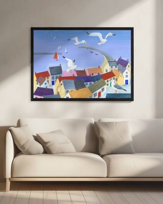 Seagulls Soaring Above Quaint Coastal Cottages