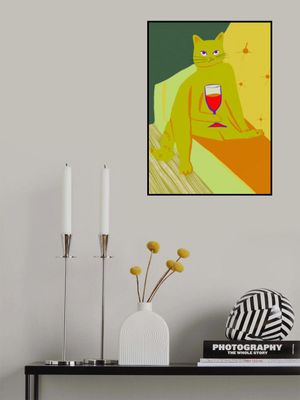 Big green cat enjoying a wine