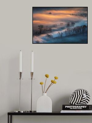 Sunrise light in the foggy valley