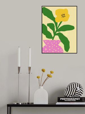 Yellow Flower With Green Leaves In A Pink Vase