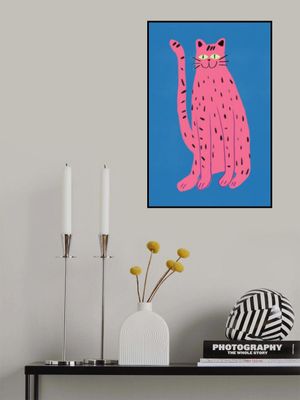 portrays a playful Pink cat