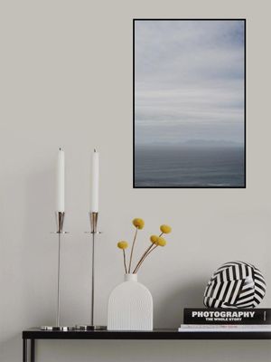 Tranquil Ocean And Distant Horizon Under A Clouded Sky