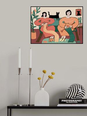 Women knitting on couch with black cat