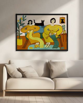 Women knitting on couch with black cat