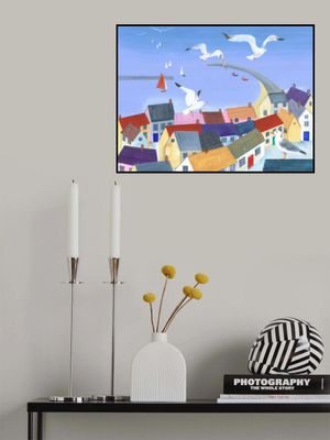 Seagulls Soaring Above Quaint Coastal Cottages