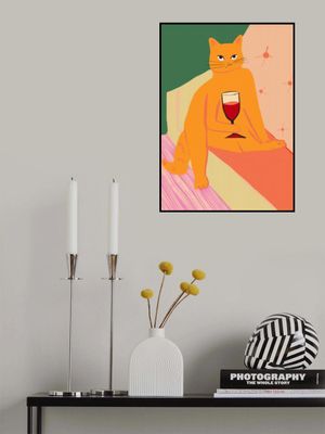 Big orange ginger cat enjoying a wine