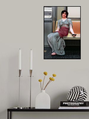 A Woman in Ancient Attire Seated in a Subway