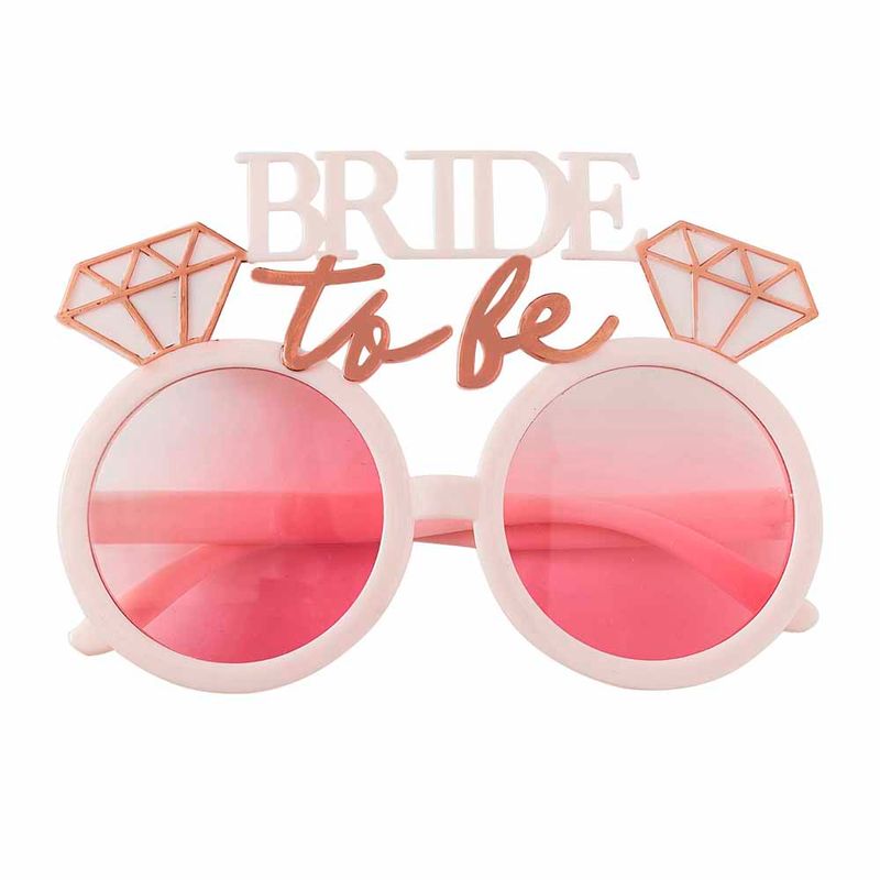 Ta med lite roliga accessoarer till möhippan som våra söta rosa och roséguld Bride To Be solglasögon.