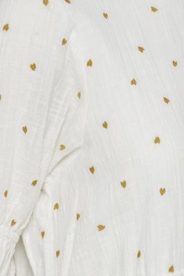 Ljuvlig klänning med broderade guldhjärtan