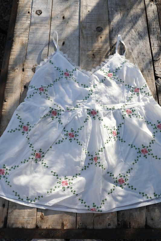 White romantic camisole with pink embroidered flowers and lace trim from Bloomingshop