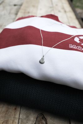Sterling silver necklace with a small shell