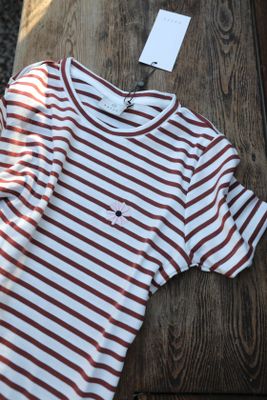 Striped top with embroidered flower