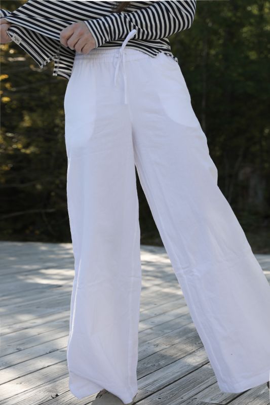 Wide-leg white cotton pants made from soft cotton fabric by Bloomingshop