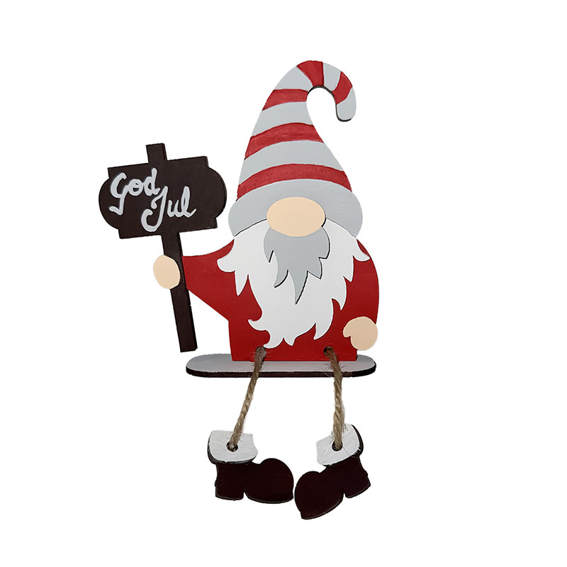 Tomte byggd av DIY-kitet Tomte på Kant med skylt. På skylten står det god jul.