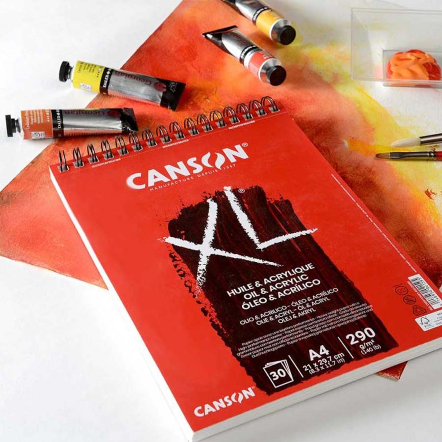 Canson block till akryl och olja tillsammans med olika färgtuber och andra målartillbehör